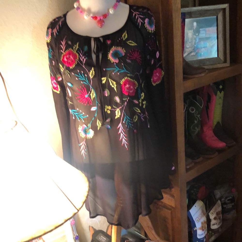 Beautiful Black sheer with embroidered floral pattern from Roja.Versatile piece.